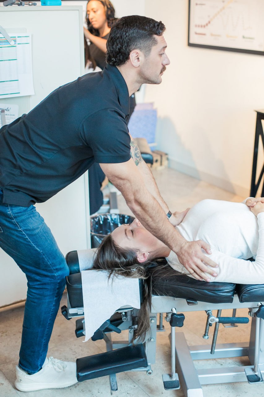 Doctor performing a cervical adjustment