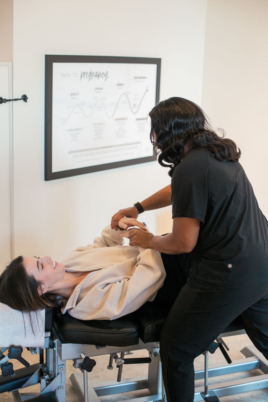 Doctor adjusting a patient